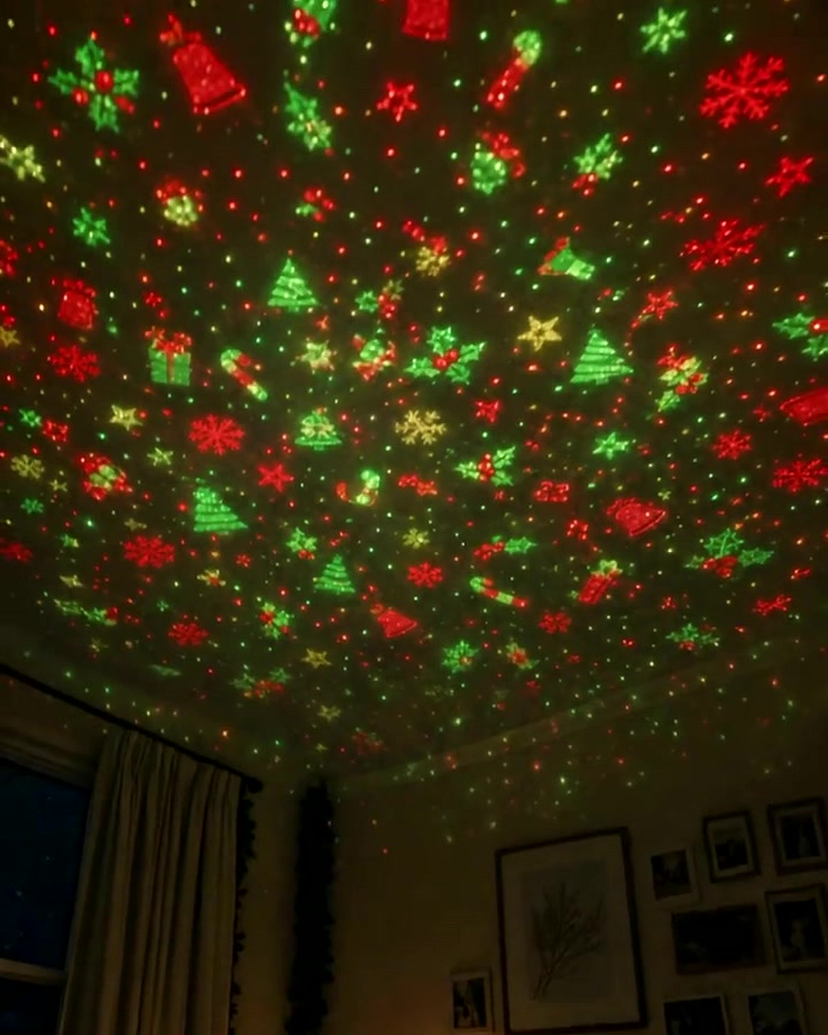 Christmas light projection covering a bedroom ceiling